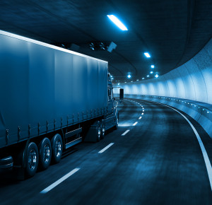 Trailer truck rides through tunnel with cold blue light style 3d rendering